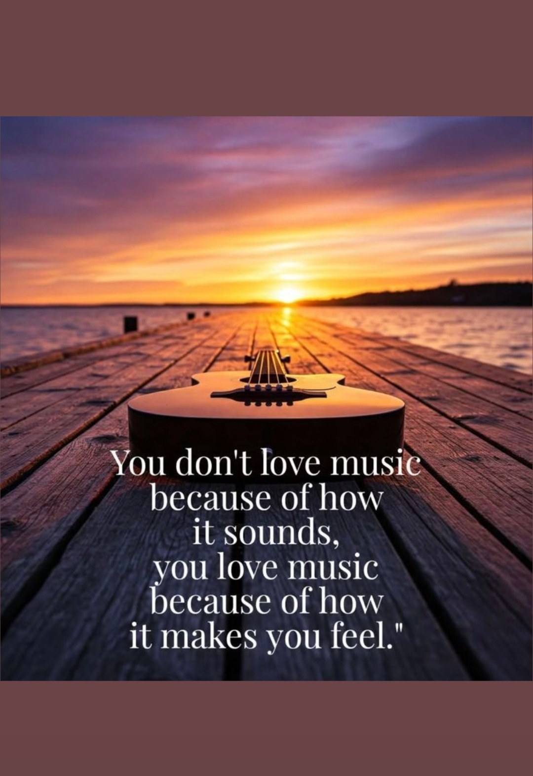 You love music because of how it makes you feel — guitar at sunset on water